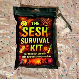 May include: Black pouch with the text "THE SESH SURVIVAL KIT" and a smiley face. The text "For the sesh gremlin that awakens after pre-drinks" is also visible. A silver bottle opener is attached to the pouch.