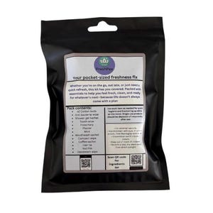 May include: A black pouch with a white label that reads "FreshPax Your pocket-sized freshness fix" and lists the contents of the pouch, including cotton buds, antibacterial wipes, shower gel, tooth wipes, floss, plasters, mouthwash, compact wipes, coffee sachets, hair ties, nail files, and deodorant wipes. A QR code is included for the ingredients list.