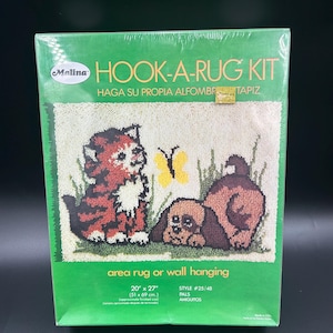 May include: A Malina Hook-A-Rug Kit with a finished size of 20" x 27". The kit features a rug design with a red and brown kitten, a yellow butterfly, and a brown dog. The kit is for an area rug or wall hanging.