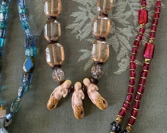 Antique beads Goddesses of the Sea.Beaded Mermaid Necklaces.3 separate colors and select your preference. Raku and clay mermaids Embellished