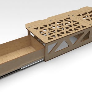 May include: A wooden storage shelf with a pull-out drawer. The shelf has a geometric pattern cut out of the wood. The drawer is open and is made of wood.