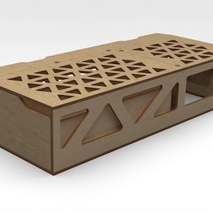 May include: A wooden storage box with a geometric pattern on the top and a cutout design on the front. The box is made of light brown wood and has a natural finish.