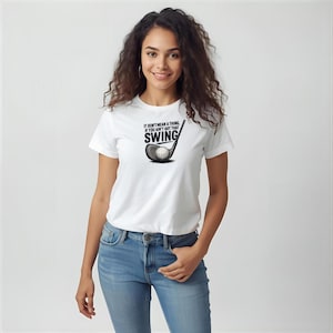 May include: White t-shirt with the text "IT DON'T MEAN A THING IF YOU AIN'T GOT THAT SWING" and a golf club graphic. The graphic is black and white. The shirt is being worn by a person.