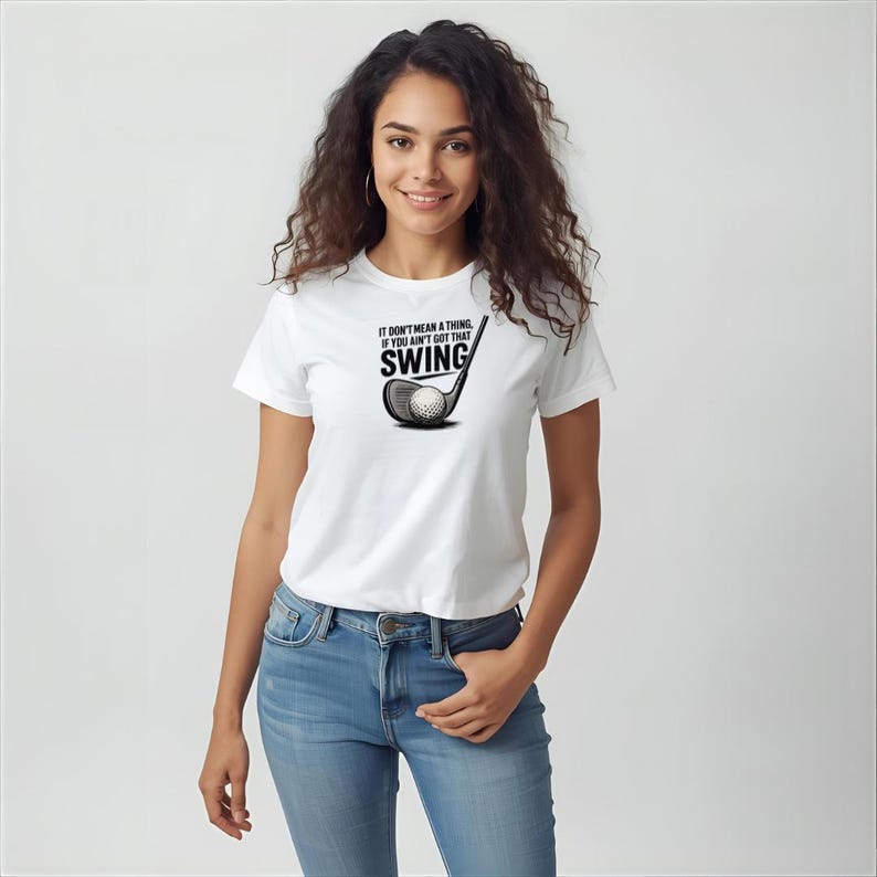 May include: White t-shirt with the text "IT DON'T MEAN A THING IF YOU AIN'T GOT THAT SWING" and a golf club graphic. The graphic is black and white. The shirt is being worn by a person.