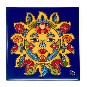 May include: A yellow sun with a smiling face surrounded by colorful flowers and swirls on a blue background. The sun has blue eyes, a red mouth, and a yellow nose. The flowers are red, orange, yellow, green, and blue.