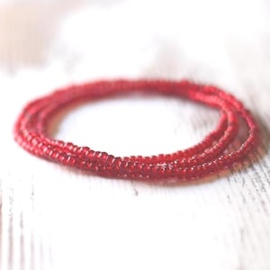 May include: A set of three ceramic mugs with a speckled, matte finish. Each mug features a different color: light blue, cream, and gray. The mugs have a simple, modern design and a comfortable handle. Perfect for coffee or tea.