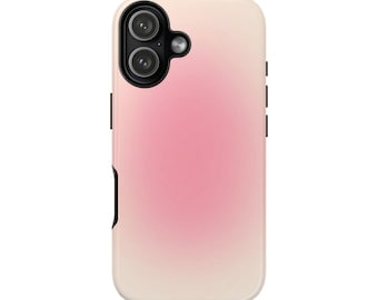 May include: A phone case with a gradient design, transitioning from a light beige at the top to a soft pink in the center. The case features a camera module with two lenses and a flash, along with black accents on the side.