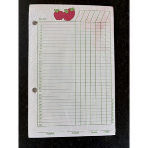 May include: A white paper grade book sheet featuring a green grid with thirty-two numbered rows for students. The top displays two red apples with green leaves. The bottom includes lines for Teacher, Subject, Grade, and Date. Text reads 1990 Creative Teaching Press Inc.