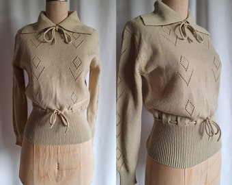 40er-Jahre-Acrylpullover, 70er-Jahre-Schößchen-Krawatten, Ton-Sand-Beige, klein, mittel