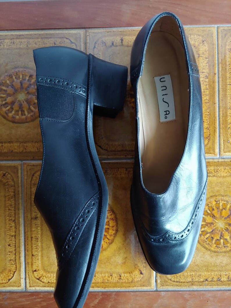 Unisa black leather slip on shoes low heel size 8