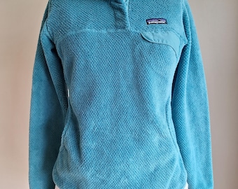 Suéter polar vintage con cierre a presión de Patagonia, bolsillo tipo canguro, color azul aguamarina y verde, talla extra pequeña