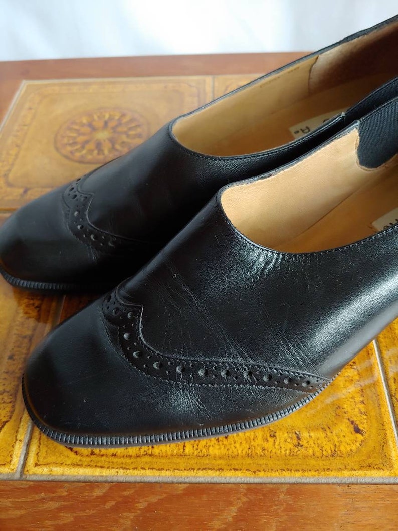 Unisa black leather slip on shoes low heel size 8
