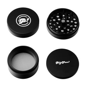 May include: A black four-piece grinder with a magnetic closure. The top lid features a white logo. The second piece has grinding teeth. The third piece has a mesh screen. The bottom lid has the text "Big Fun!" in white.