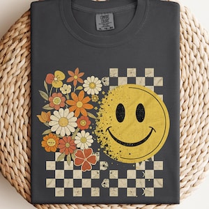 Retro Smiley Face T-Shirt: 70s Groovy Floral Checkerboard Tee