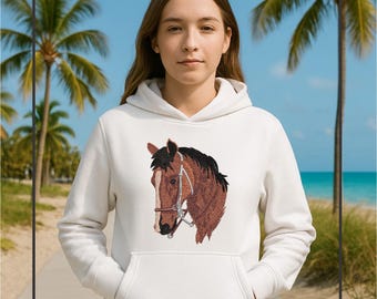 May include: White hooded sweatshirt featuring an embroidered horse head. The horse has brown and black fur with a white stripe on its face and a bridle. The sweatshirt has a front pocket and a drawstring hood.