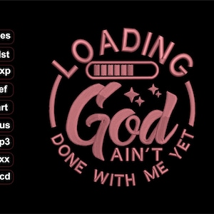 May include: Pink embroidered design on a black background. The design features the words "LOADING God AIN'T DONE WITH ME YET" in a circular layout, with a loading bar graphic above the word "God".