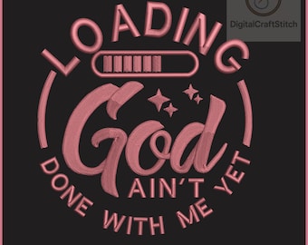 May include: An embroidery design featuring the text LOADING in a circular arc above a progress bar, with the word God in large script below, and the text AIN'T DONE WITH ME YET in a circular arc at the bottom, all in pink on a black background.