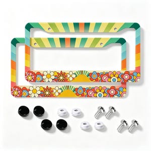 May include: Two rectangular license plate frames featuring a colorful sunburst pattern on the top and a row of multi-colored flowers and suns along the bottom. The set includes four black screw caps, four white screw caps, and four metal screws.