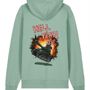 Puede incluir: Sudadera con capucha verde claro con una ilustración de dibujos animados de una rata en un tanque con una explosión. El texto "HELL YEAH!" está encima de la ilustración.