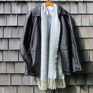 Handmade Light Blue Chalcedony Artisan Hand Woven Scarf Shawl or Table Runner for Positive Natural Energy, Spiritual Serenity, Harmony, Grounding Meditation Prayer is a Gender Neutral Unisex Men's Women's Long Fall, Winter, Spring, Urban Casual Rustic Fashion Accessory Wrap or Home Decor Accent Handcrafted by Amy C. Lund in Cotton Blend. Styled with a black leather coat.