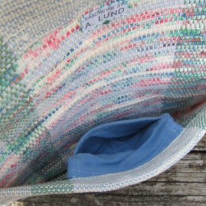 Upcycled Fabric Clutch Wallet, Boho Cloth Purse Pastel Wristlet Hand Bag, Handmade Hand Woven Zero Waste Sustainable Eco Vegan Recycled Accessories, Travel Jewelry Phone Pouch, Casual Spring or Summer Slow Fashion Accessory Handcrafted by Amy C. Lund in Pastel Pink, Green, Blue and Cream White with Button Accent. Showing detail of small inside pocket.