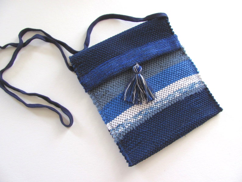 Small Crossbody Bag Wallet or Phone Purse is Handmade, Artisan Hand Woven in Indigo Navy Blue with Zero Waste, Eco Friendly Upcycled Cloth, Vegan Recycled Fabric. This Sustainable Slow Fashion Accessory Handbag, Boho Cash Change Pouch or Money Shoulder Pouch is Handcrafted by Amy C. Lund.