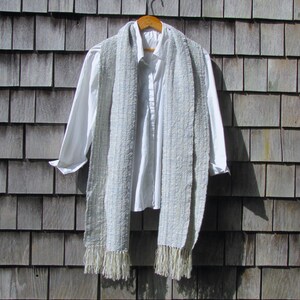 Handmade Light Blue Chalcedony Artisan Hand Woven Scarf Shawl or Table Runner for Positive Natural Energy, Spiritual Serenity, Harmony, Grounding Meditation Prayer is a Gender Neutral Unisex Men's Women's Long Fall, Winter, Spring, Urban Casual Rustic Fashion Accessory Wrap or Home Decor Accent Handcrafted by Amy C. Lund in Cotton Blend. Styled with a white dress shirt.