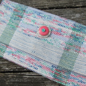 Upcycled Fabric Clutch Wallet, Boho Cloth Purse Pastel Wristlet Hand Bag, Handmade Hand Woven Zero Waste Sustainable Eco Vegan Recycled Accessories, Travel Jewelry Phone Pouch, Casual Spring or Summer Slow Fashion Accessory Handcrafted by Amy C. Lund in Pastel Pink, Green, Blue and Cream White with Button Accent.