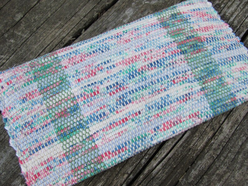 Upcycled Fabric Clutch Wallet, Boho Cloth Purse Pastel Wristlet Hand Bag, Handmade Hand Woven Zero Waste Sustainable Eco Vegan Recycled Accessories, Travel Jewelry Phone Pouch, Casual Spring or Summer Slow Fashion Accessory Handcrafted by Amy C. Lund in Pastel Pink, Green, Blue and Cream White with Button Accent. Reverse side.