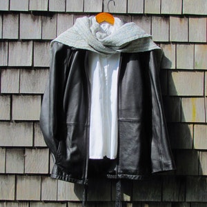 Handmade Light Blue Chalcedony Artisan Hand Woven Scarf Shawl or Table Runner for Positive Natural Energy, Spiritual Serenity, Harmony, Grounding Meditation Prayer is a Gender Neutral Unisex Men's Women's Long Fall, Winter, Spring, Urban Casual Rustic Fashion Accessory Wrap or Home Decor Accent Handcrafted by Amy C. Lund in Cotton Blend. Styled with a black leather coat.