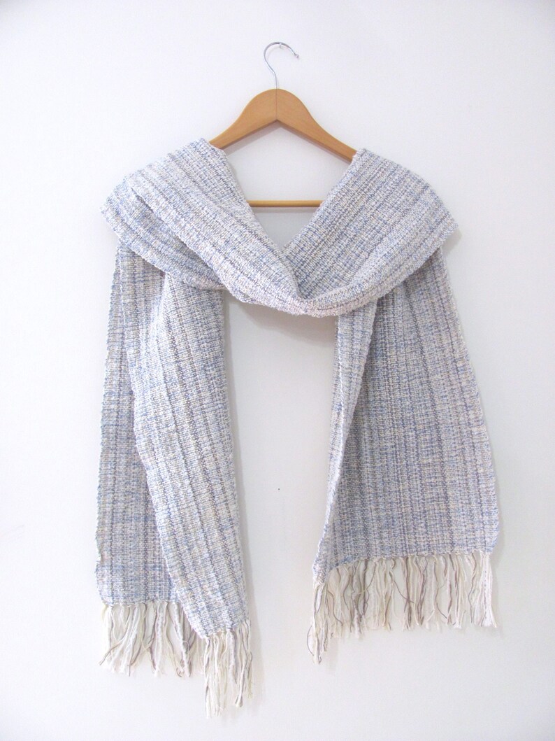 Handmade Light Blue Chalcedony Artisan Hand Woven Scarf Shawl or Table Runner for Positive Natural Energy, Spiritual Serenity, Harmony, Grounding Meditation Prayer is a Gender Neutral Unisex Men's Women's Long Fall, Winter, Spring, Urban Casual Rustic Fashion Accessory Wrap or Home Decor Accent Handcrafted by Amy C. Lund in Cotton Blend. Styled on a hanger.