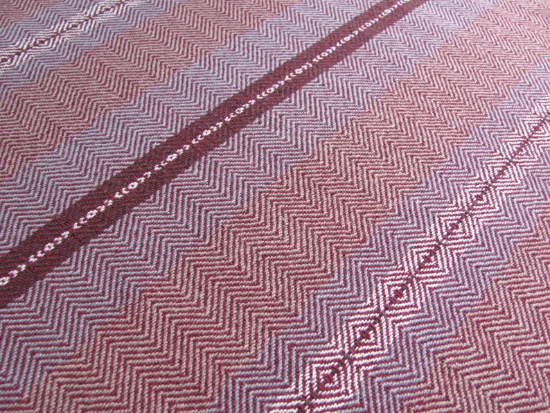 Handcrafted Kitchen Dish Towel, Gourmet Baking, Home Cooking gift for Chef, Baker, Cook, Foodie. An Eco Sustainable, Reusable, Artisan Handmade Cookware Kitchenware Accessory Hand Woven Cotton Towel by Amy C. Lund in Deep Burgundy Red, Beige, White & Fudge Brown Stripe Cloth for Rustic French Country or Modern Farmhouse Decor with alternating Chevron Diamond Zig Zag Herringbone. Detail of color and weave pattern.