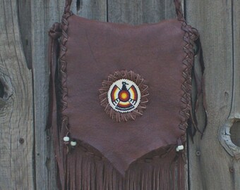 Brown leather bag with thunderbird totem , Fringed crossbody bag