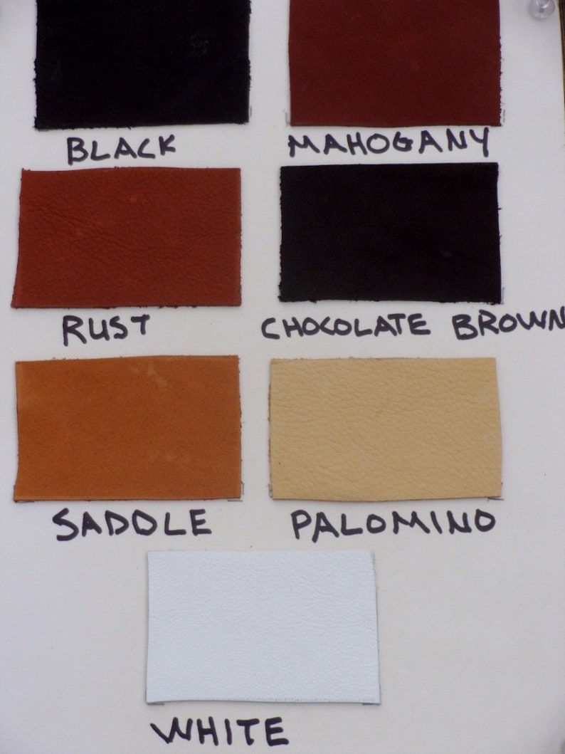 May include: Leather swatches in various colors, including black, mahogany, rust, chocolate brown, saddle, palomino, and white. The swatches are labeled with their corresponding color names.