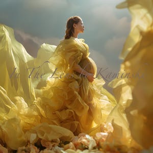 May include: A woman in a flowing, yellow gown stands against a cloudy sky. The dress features layers of ruffled fabric, and the woman is cradling her pregnant belly. The image has the text "In The Lens by Kaminski".
