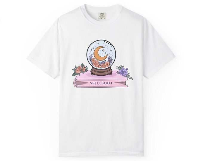 Spellbook Graphic T-Shirt: Witchy Snow Globe Design