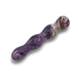 May include: A purple and white amethyst wand with a curved, ergonomic design. The polished stone features natural colour variations and a smooth, rounded tip. The wand is designed for massage or therapeutic use.