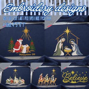 May include: Five embroidery designs on dark blue fabric. Top left: Santa kneeling by a manger with trees and text "Philippians 2:10". Top right: Nativity scene. Bottom left: Winter village. Bottom center: Three wise men on camels. Bottom right: "Believe" text.