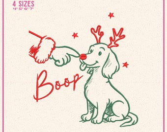 May include: Machine embroidery design featuring a green outline of a dog wearing red reindeer antlers and a red nose. A hand in a red and white cuff pokes the dog's nose with the text Boop. Includes 4 sizes 4, 5, 6, 7 inches and file formats.