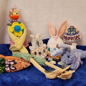 Lot of Easter Home Décor including 3 Boxes Egg Bunny Carrot a Purple Stuffed Bunny a Ornament Bunny w Button Legs and a ShelfSitter Chick