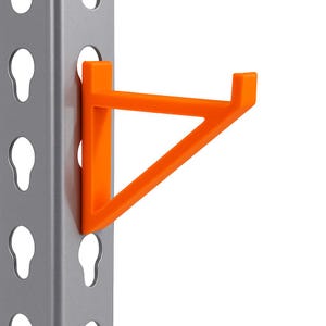May include: An orange, triangular shelf bracket attached to a gray metal shelving unit. The bracket is made of plastic and is designed to support a shelf. The shelving unit has a series of keyhole-shaped holes.