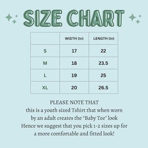 May include: A light blue size chart for a youth t-shirt with dark green text. The table lists sizes S, M, L, and XL with corresponding width and length measurements in inches. It includes a note about the fit for adults to achieve a baby tee look.