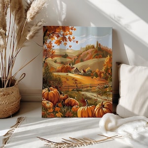Peut inclure: Une impression sur toile représentant un paysage d'automne avec des collines, une ferme et des citrouilles. L'œuvre utilise des couleurs chaudes comme l'orange, le marron et le jaune, évoquant le thème de la récolte. Les citrouilles sont regroupées au premier plan.