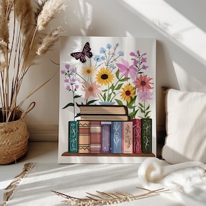 May include: A canvas print featuring a stack of books with colorful flowers and a butterfly. The flowers include sunflowers, daisies, and pink blooms. The books are on a wooden shelf, with decorative spines in various colors.