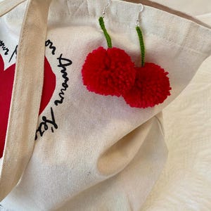 Cherry- inspired pompom earrings