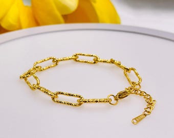 Pulsera minimalista de acero inoxidable con clip de papel dorado, resistente al agua, hipoalergénica y chapada en oro de 18 quilates.