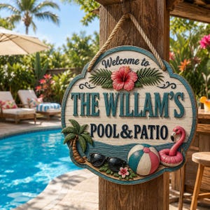 May include: A round wooden hanging sign with a rope hanger, featuring the text "Welcome to THE WILLAM'S POOL & PATIO". The sign is decorated with a red hibiscus flower, a palm tree, black sunglasses, a beach ball, and a pink flamingo pool float.