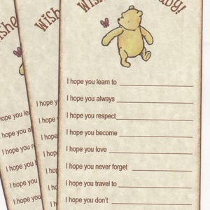 May include: A Winnie the Pooh themed baby shower card with the text "Wishes for baby!" and a list of wishes for the baby, such as "I hope you learn to", "I hope you always", "I hope you respect", "I hope you become", "I hope you love", "I hope you never forget", "I hope you travel to", "I hope you don't", "I hope you laugh", and "With Love, ".