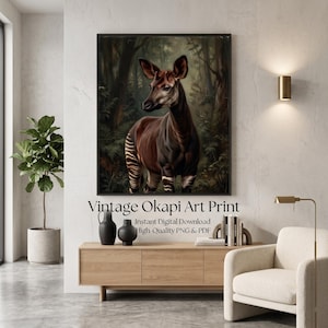 May include: A framed wall art print featuring a detailed illustration of an okapi standing in a lush, dark forest setting. The okapi has a brown coat with distinctive white horizontal stripes on its hindquarters and legs, set against deep green foliage.