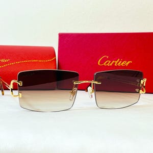 Lunettes de vue Cartier sans monture, gros C, monture dorée et verres teintés marron Lunettes vintage